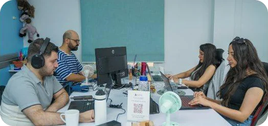 The team at work in the open-plan office