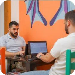 A one-to-one session in the orange meeting corner