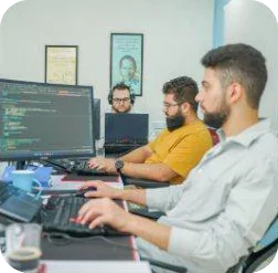 Developers coding side by side