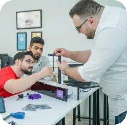 Engineers assembling a hardware prototype