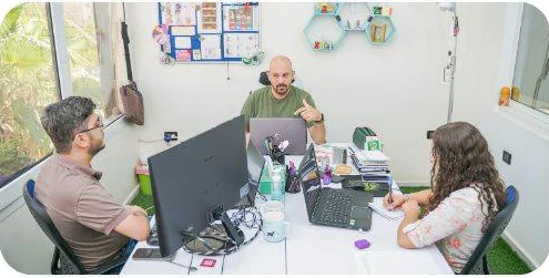 A small-team meeting in the planning room